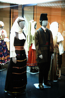Woman and Man in Valjevo area costume. Notice the headress, called kondža, worn in the L.19th and E.20th centuries. EMB.