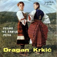 45 rpm record sleeve showing Pre (R) and Post (L) WWI Šumadija costumes side by side. The beautiful pargar is shown.